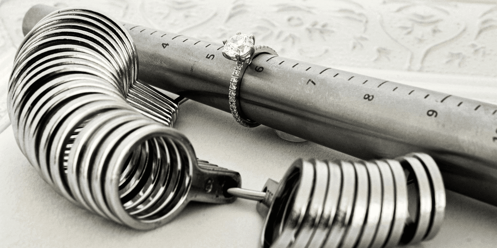 Diamond engagement ring around ring sizer