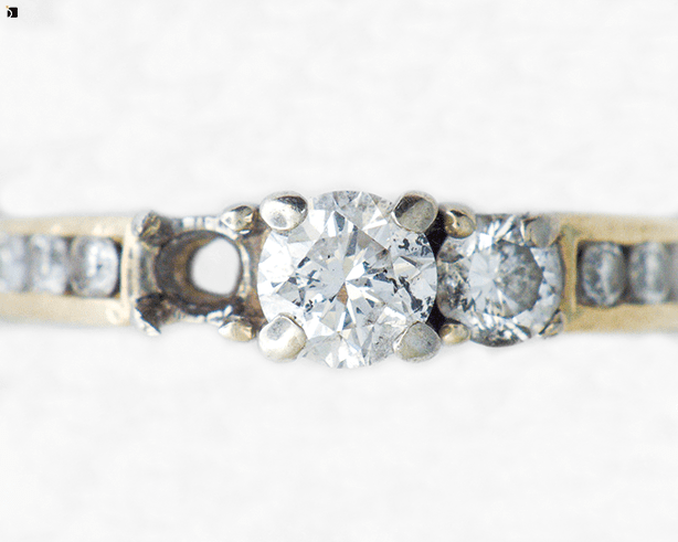 Image Showcasing Before #20 of a Diamond Gold Ring Getting Premier Gemstone Replacement Services by Master Jewelers