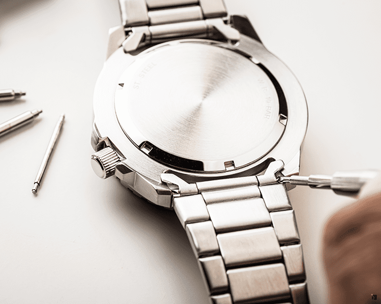 Certified Watchmaker Servicing Timepiece Metal Link Bracelet with Premier Watch Band Repair Services