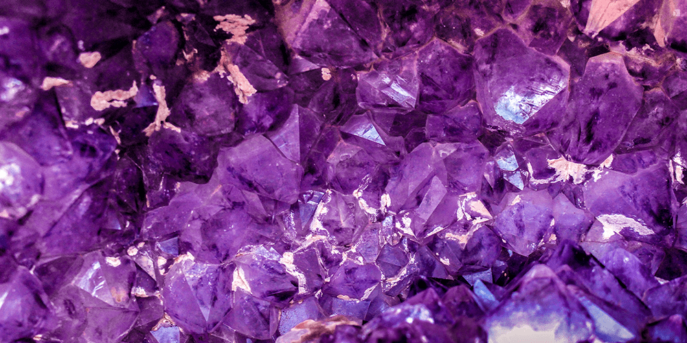 Close Up Shot of Raw Uncut Amethyst Gemstone February Birthstone