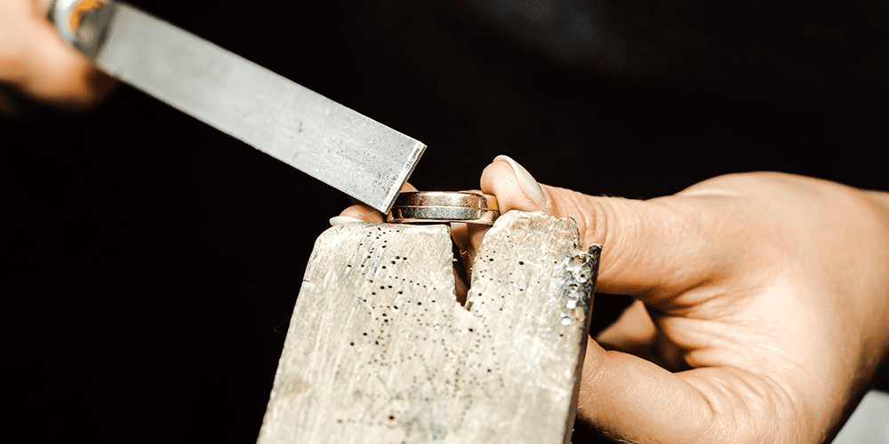 Master Jeweler Performing Premier Soldering Repair Services on a Ring