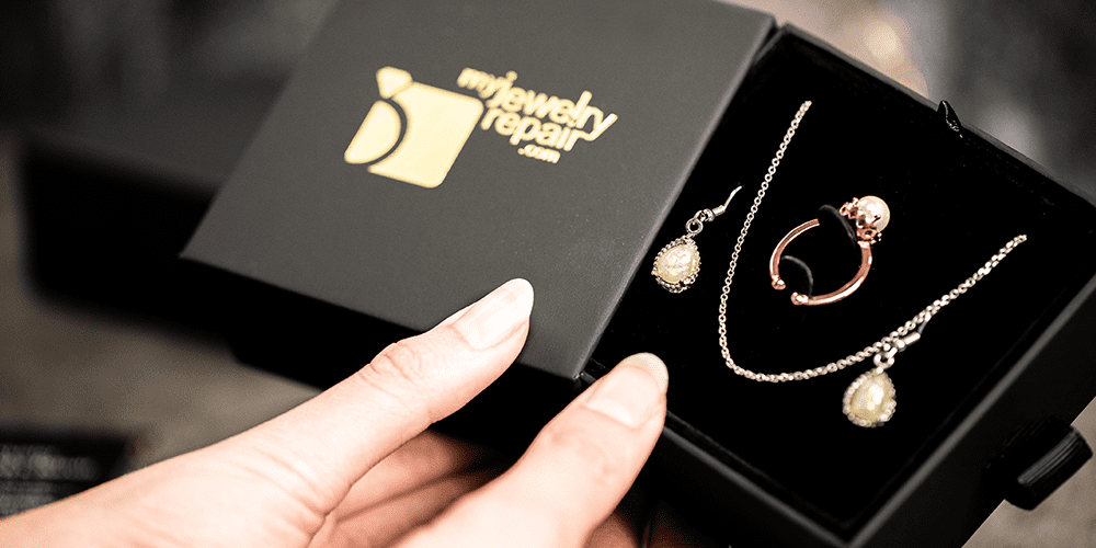 Image showcasing My Jewelry Repair's official box with repaired jewelry inside