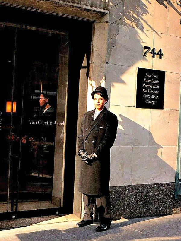 Photo of Van Cleef & Arpels employee standing outside of store