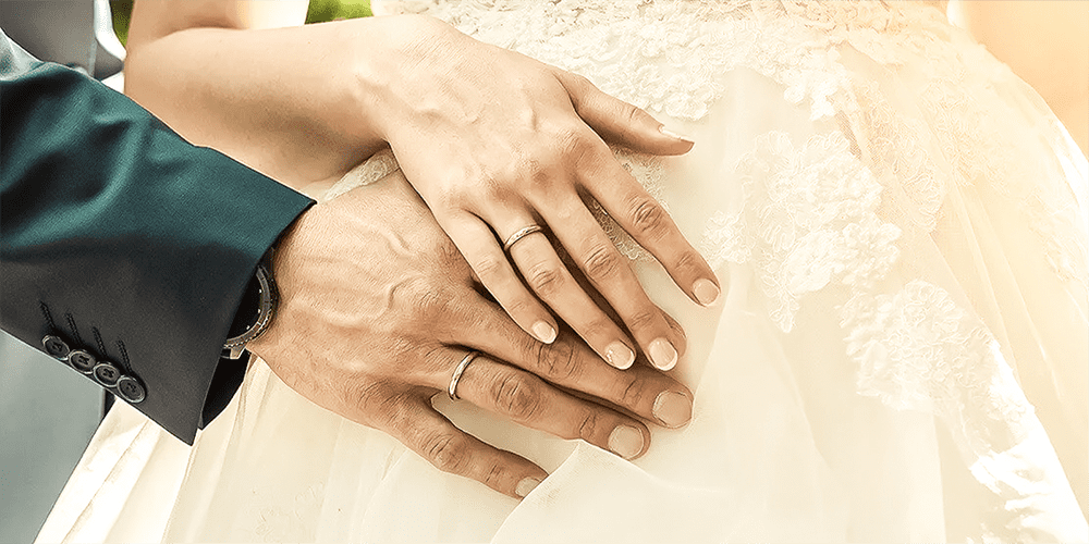 Groom and Bride Posing Together at Wedding Wearing Restored Wedding Bands and Timepiece Watch
