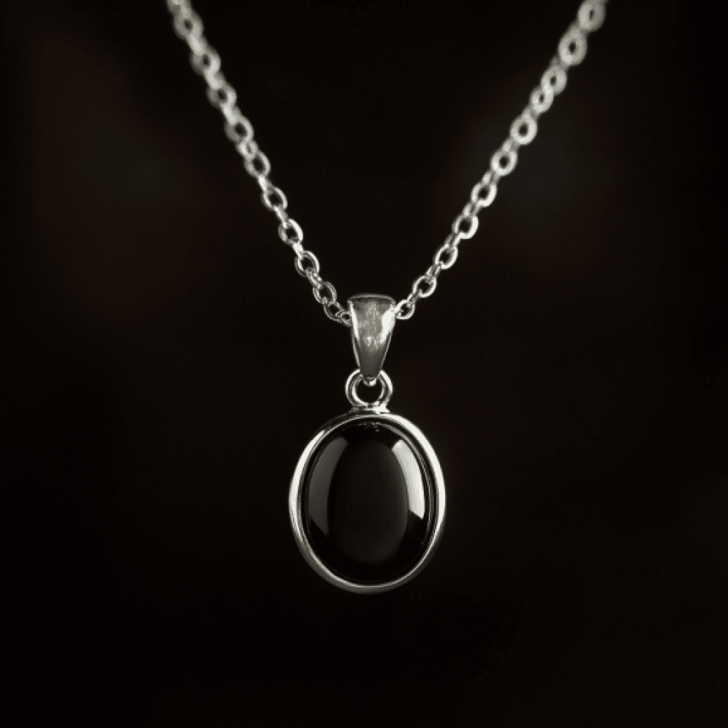 Image showcasing garnet pendant necklace on black background