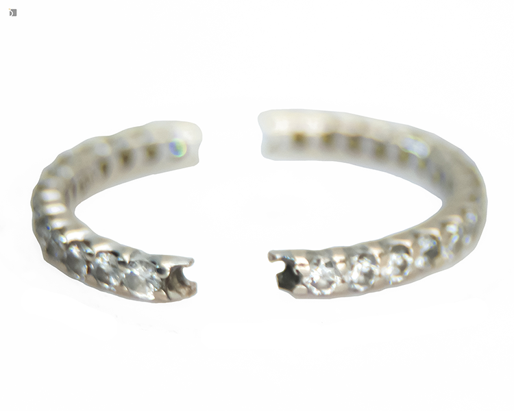 Before #177 Close up view of diamond eternity band break prior to work of master jewelers