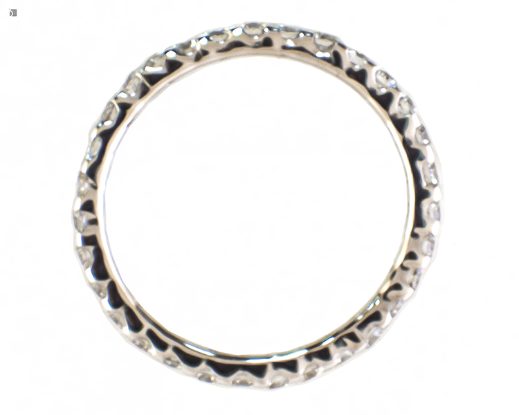 After #177 Top angled view of diamond eternity band broken in half after professional ring repair services