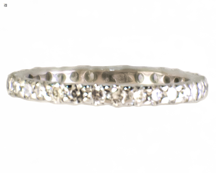 After #177 Side view of 14kt white gold diamond wedding eternity band repaired by professional ring repair services
