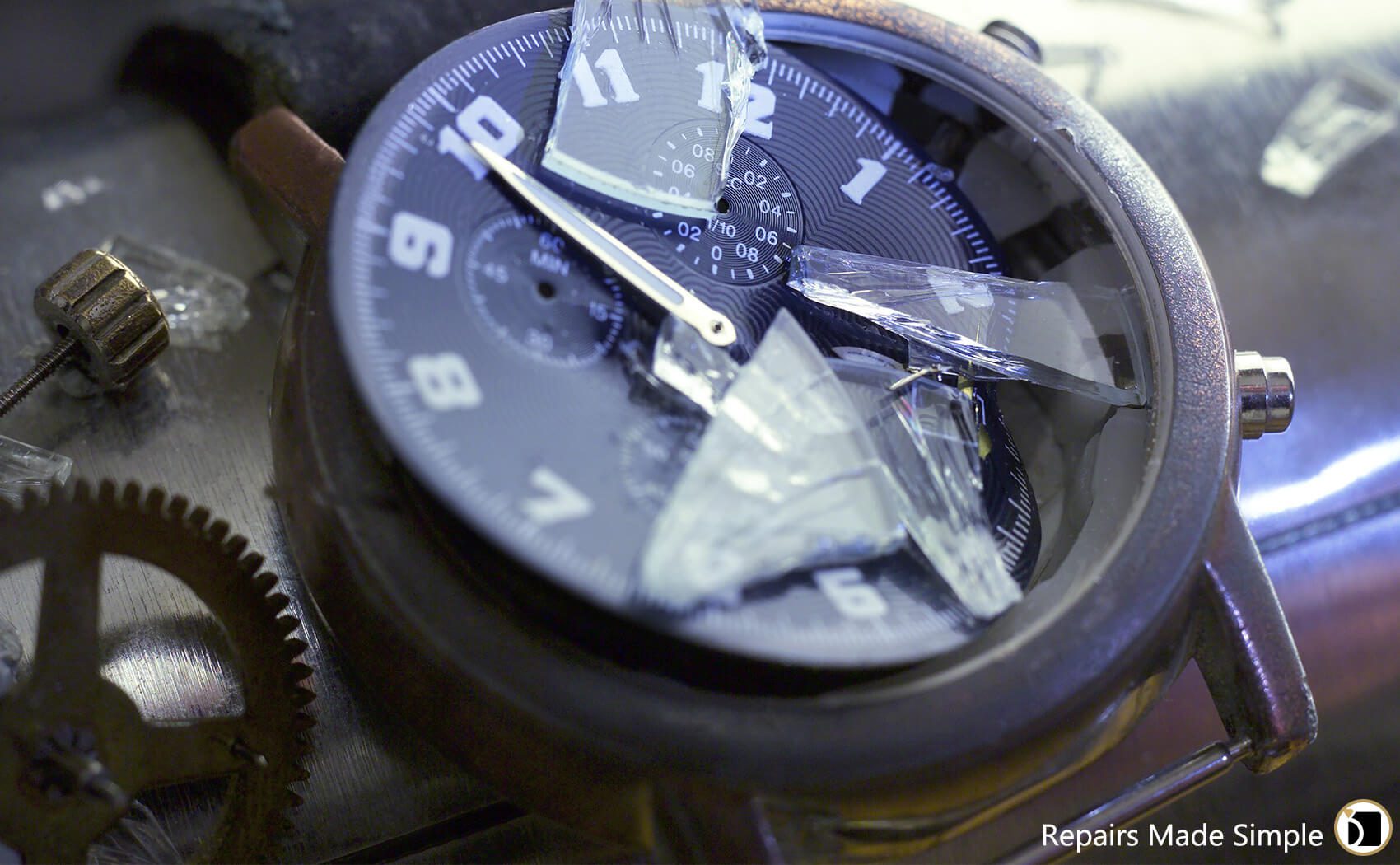 Got A Shattered Crystal? Image showcasing damaged watch that needs a watch crystal replacement